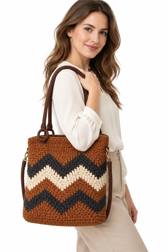 AI concept of a copper crochet handbag with chevron pattern and frame closure.