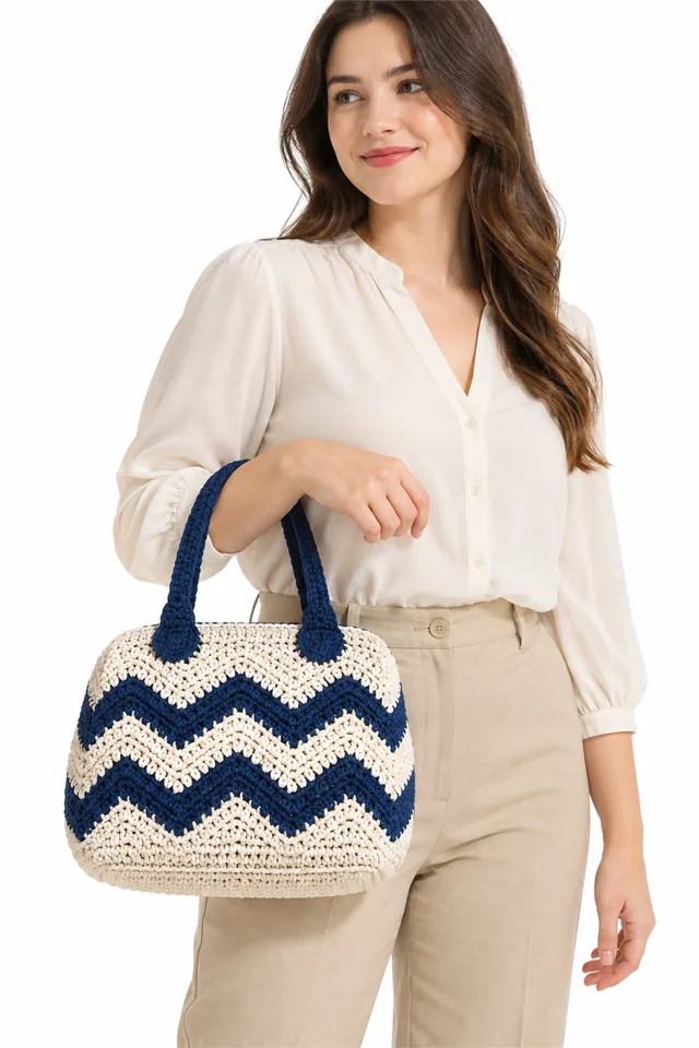 AI concept of an ivory crochet purse with sapphire zigzag art deco pattern.