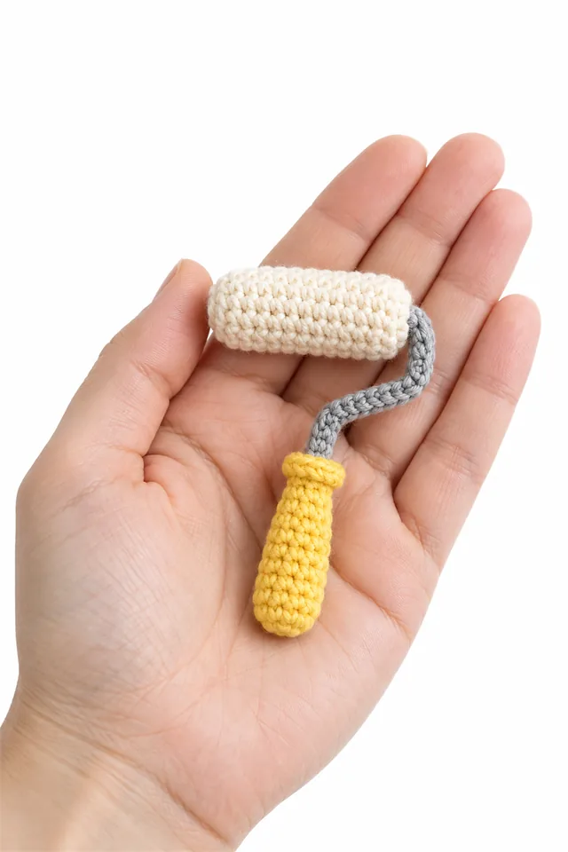AI concept of a miniature yellow crochet paint roller with cream sleeve.